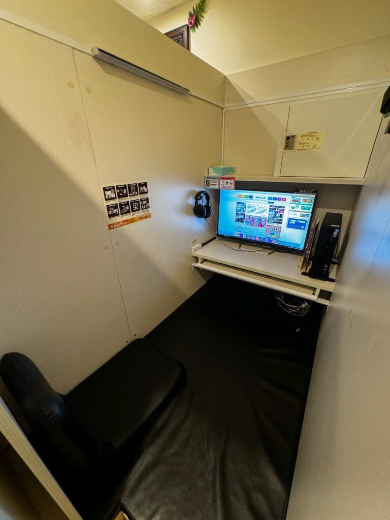 inside a booth at internet cafe, japan