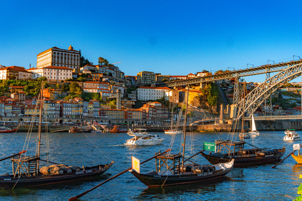 things to do in Porto - Ribeira district in Porto Portugal with cafes and colorful tiled houses along the Douro River