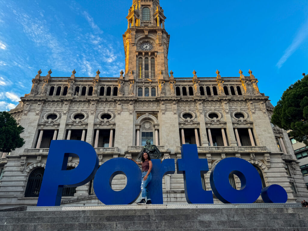 PORTO sign in front of Porto City Hall with traveler taking a photo during city walk in Portugal