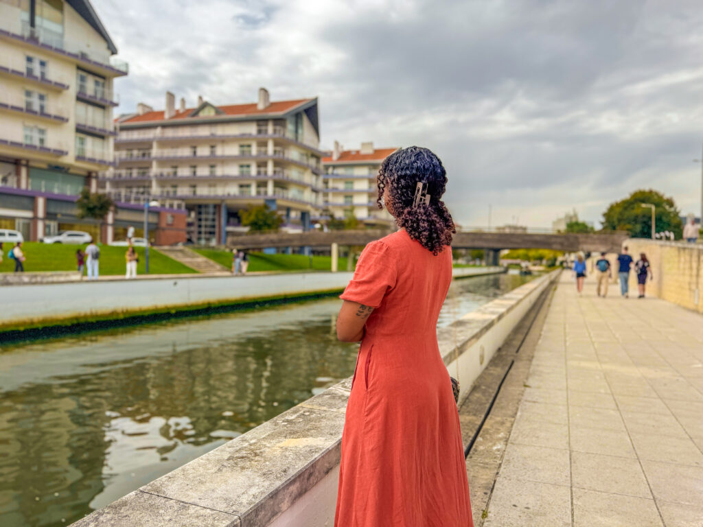 Woman standing peacefully in Aveiro, Portugal itoeatz travel reflections of 2025