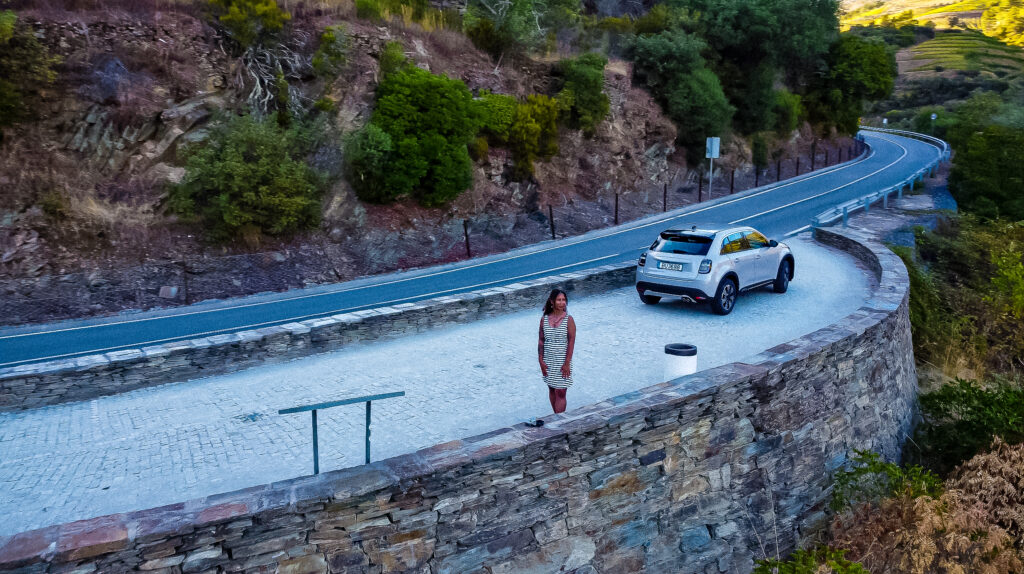 traveler with a rental car for road trip through douro valley 
