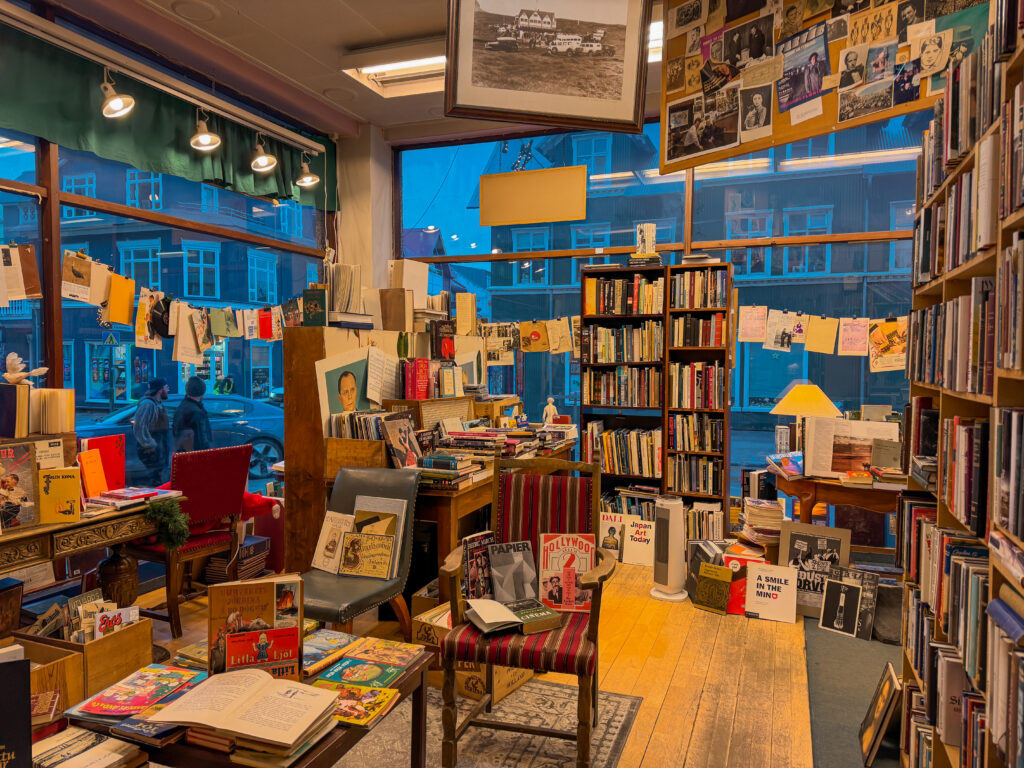 Interior of Bokin bookstore floor to ceiling shelves Reykjavik Iceland
