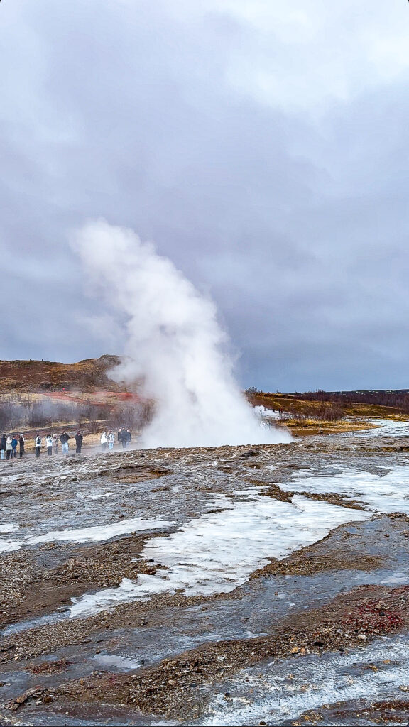 The moment of eruption at the Strokkur geyser along the Golden Circle in Iceland during winter.