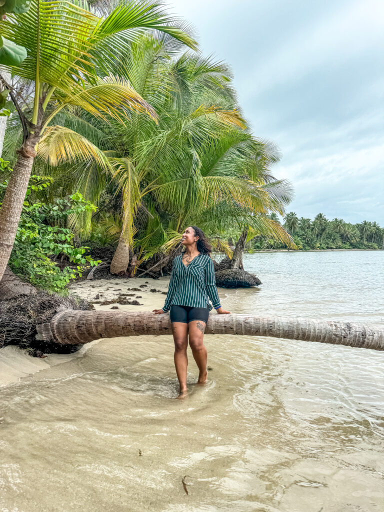 beautiful black woman admiring the view at Starfish Beach on Isla Colon.
