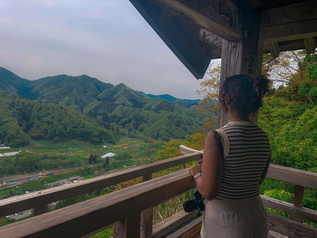 beautiful black woman standing at godaido in yamadera japan itoeatz