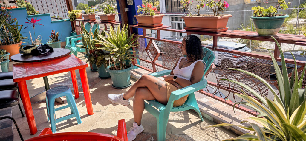 black female traveler relaxing on a balcony in san jose costa rica