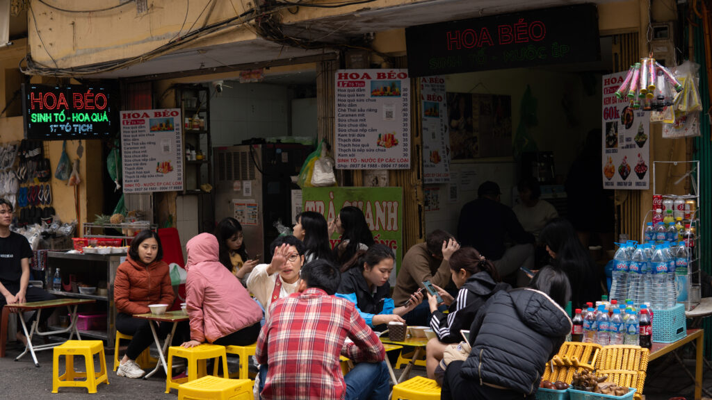small local restaurant in hanoi, vietnam with vendors selling fresh food